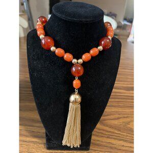 Brown gold beaded necklace with gold tone tassels vintage
